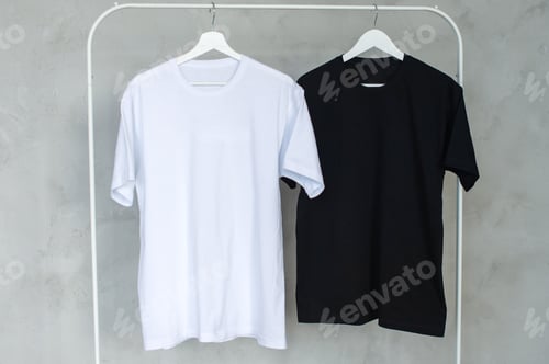 Preview: Black and white T-shirt hanging on a hanger, layout