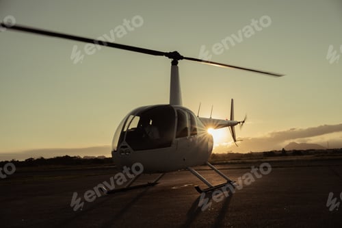 Preview: Helicopter on the runway at sunset.