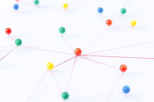 Preview: The connection between the two networks. Network simulation on paper linked together by yarn