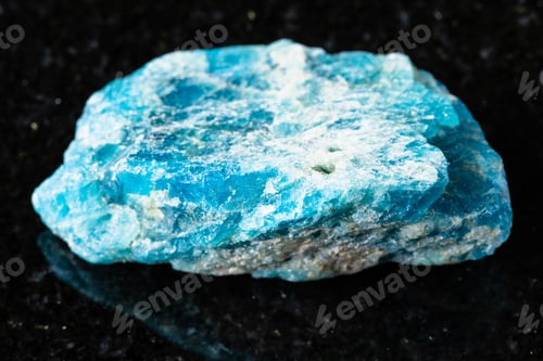 Preview: sample of uncut apatite rock on black granite