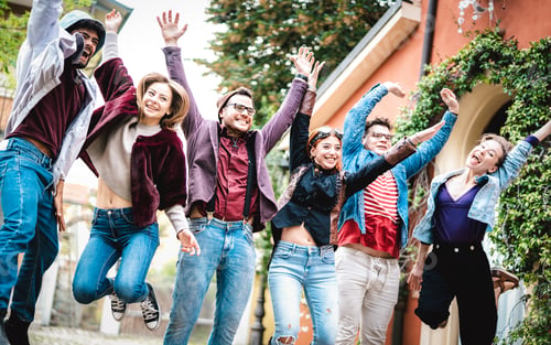 Preview: University college students jumping and cheering by end of school at campus yard