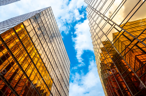 Preview: Golden skyscrapper building with blue sky in Hong Kong. Windows glass of modern office