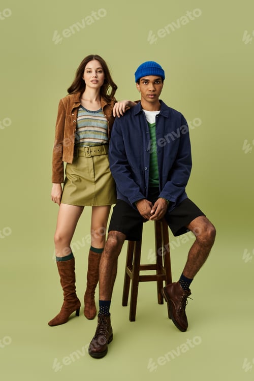 Preview: Young fashionable couple showcasing vibrant autumn styles in a trendy setting