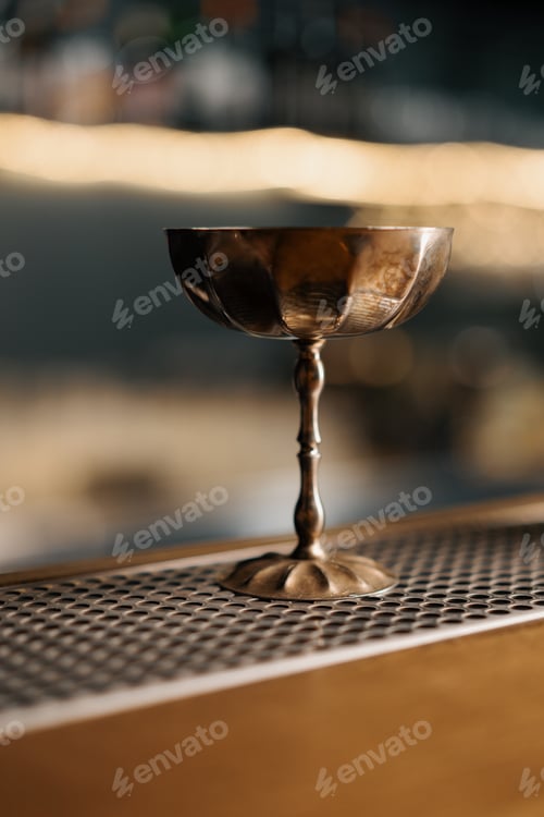 Preview: beautiful and elegant cocktail ware on bar concept of alcoholic drinks golden glass