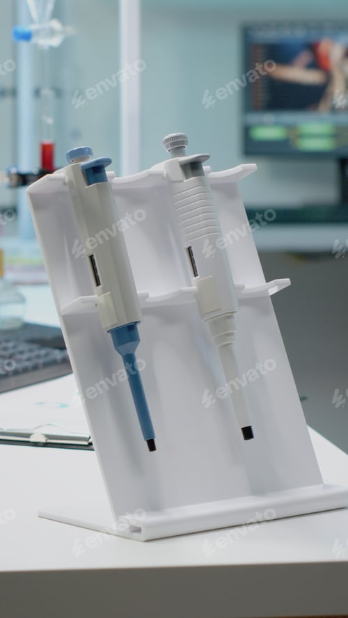 Preview: Scientific micropipette and microscope in laboratory