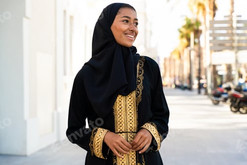 Preview: Traditional arab woman wearing abaya outdoors
