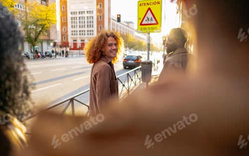 Preview: Group of young tourists exploring city street during vacation