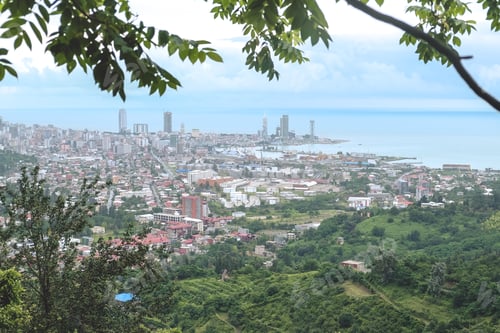 Preview: Panorama of the city at the foot of the mountain. Travel in the mountains, holidays in the mountains