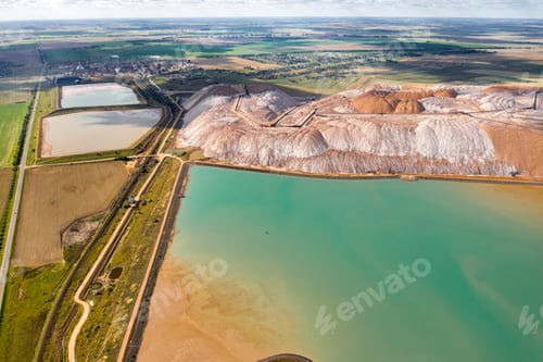 Preview: Mountains of products for the production of potash salt and artificial turquoise reservoirs.Salt