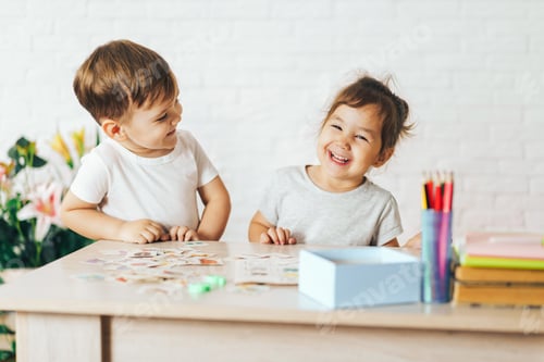 Preview: Boy and girl playing educational games in the school class