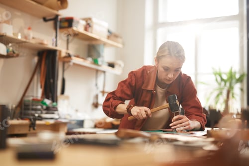 Preview: Artisan Using Hammer For Leatherwork