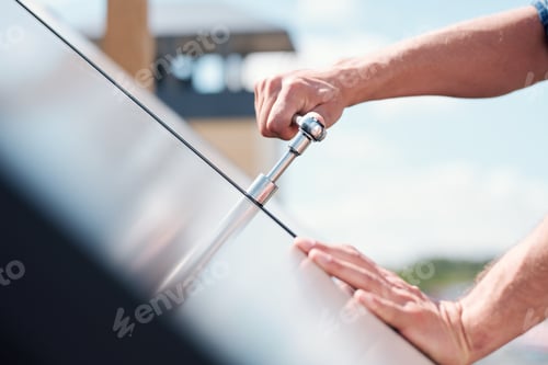 Preview: Hand of technician master turning steel handle or worktool