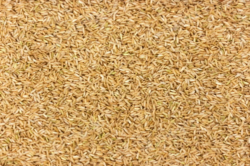 Preview: Pile of Uncooked Brown Rice Texture Background