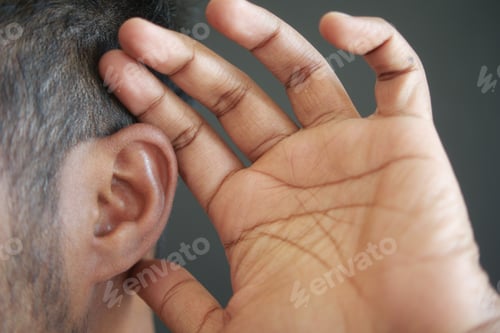 Preview: young man having ear pain touching his painful ear ,