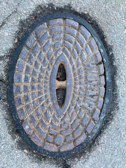 Preview: Vertical top view of an old metal manhole