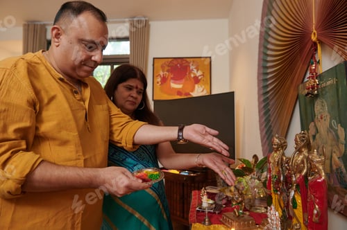 Preview: Indian Couple Making Offerings At Altar