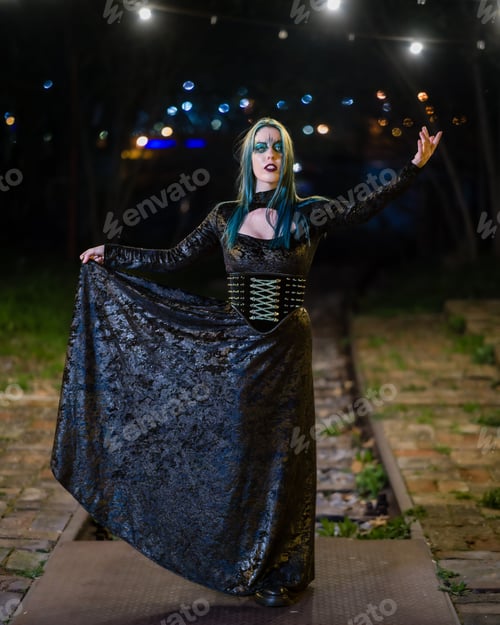 Preview: Portrait of a hot woman in a gothic costume posing outdoors at night
