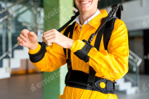 Preview: unrecognizable employee with an exoskeleton from a futuristic high-tech warehouse