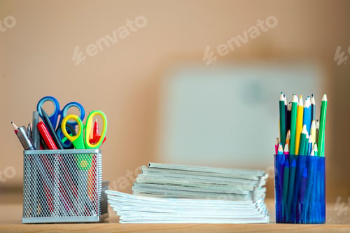 Preview: Stack of notebooks, colorful drawing pencils