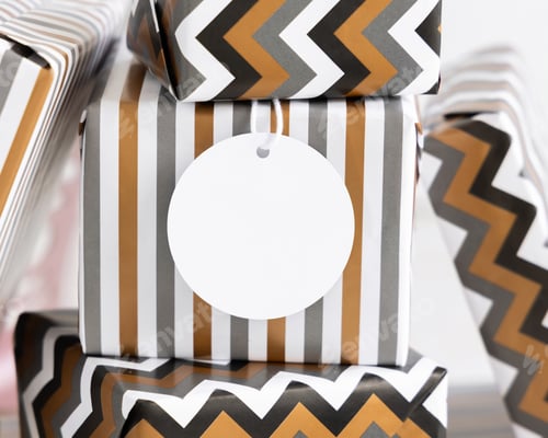 Preview: Wrapped present with blank round gift tag close up, label Mockup