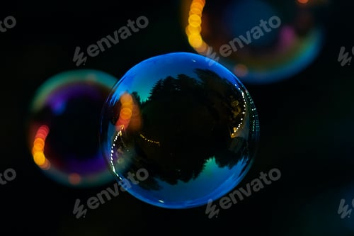 Preview: Closeup shot of floating soap bubbles with reflection on dark background