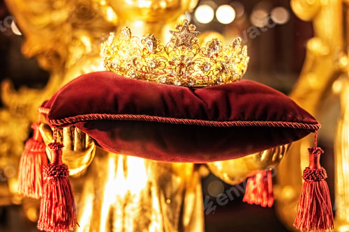 Preview: Golden crown with precious stones on a red velvet pillow in a classic style.