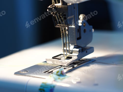 Preview: Closeup shot of a tailor's electronic machine sewing clothes