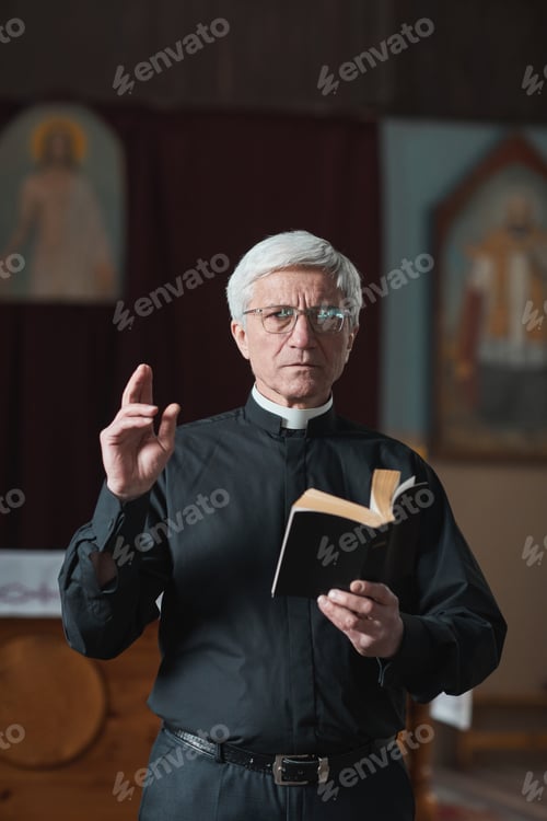 Preview: Senior priest reading the Bible