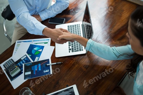 Preview: Business executives shaking hands during meeting