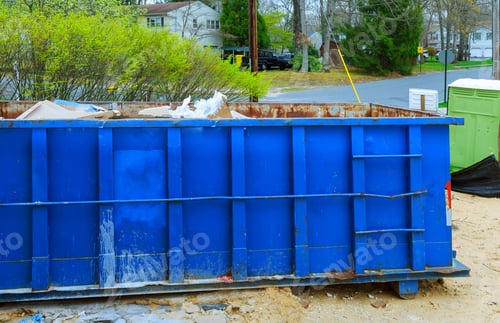 Preview: Blur dumpster, recycle waste and garbage bins near new construction of appartment houses building