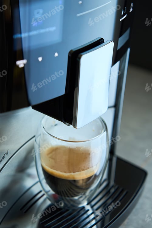 Preview: Coffee machine with fresh espresso in glass cup