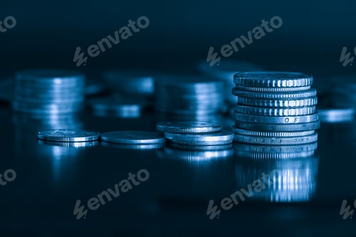 Preview: close up pile of money coin and stack on black background with blue filter