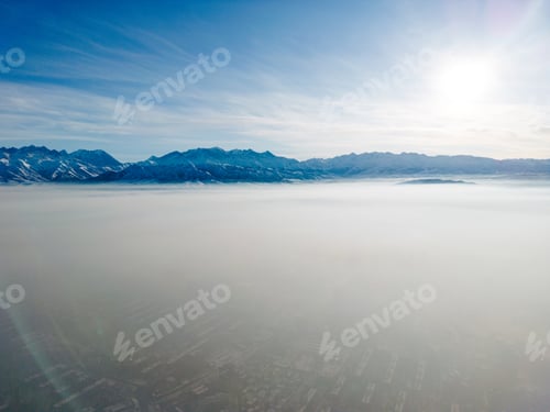 Preview: Aerial view of polluted city covered with smog