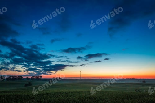 Preview: Beautiful sunrise at foggy field in summer, Europe