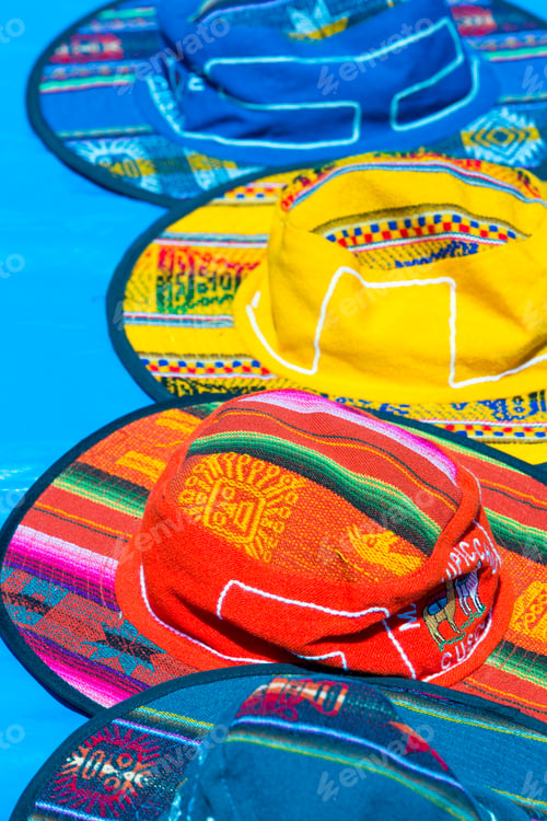 Preview: Group of colored tourist hats for sale at the market in Cusco, P
