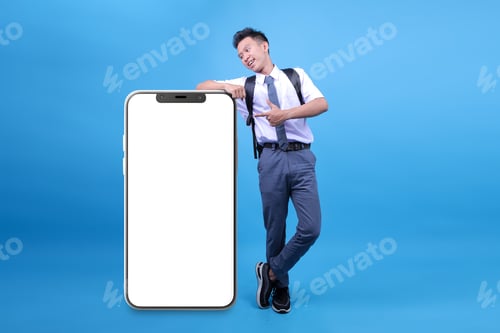 Preview: Student Male Leaning on Huge Smartphone with Blank White Screen, Recommending Great New