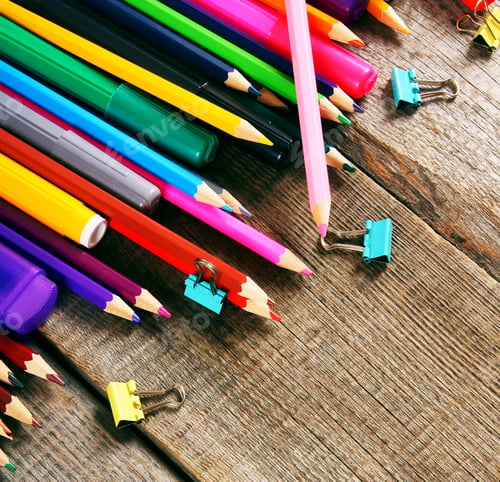 Preview: School tools. On wooden background.