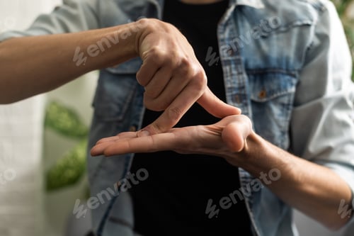 Preview: Man Using Sign Language To Communicate At Home