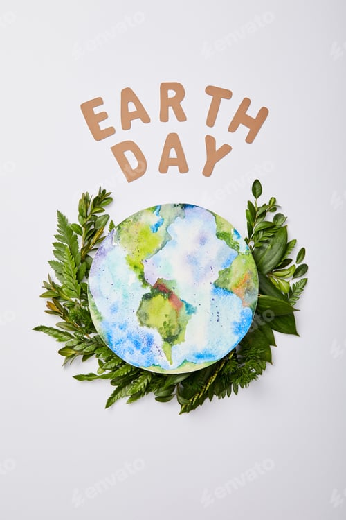Preview: top view of fresh green fern leaves with paper letters and planet picture isolated on grey