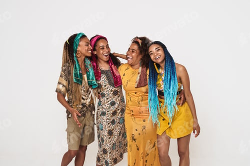 Preview: Young black four women wearing dress hugging and laughing