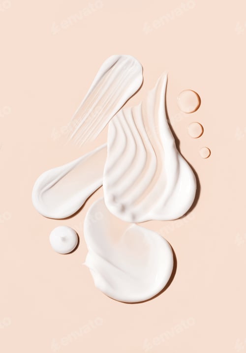 Preview: composition of smears of cream texture on a beige background