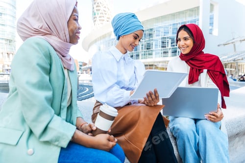 Preview: Beautiful muslim girl wearing hijab bonding outdoors