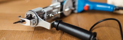 Preview: Tufting Gun Close Up on Wooden Surface