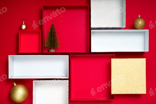Preview: Christmas display with gift boxes and ornaments on red