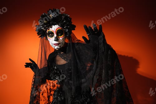 Preview: Woman in creepy santa muerte costume and wreath looking at camera on red background
