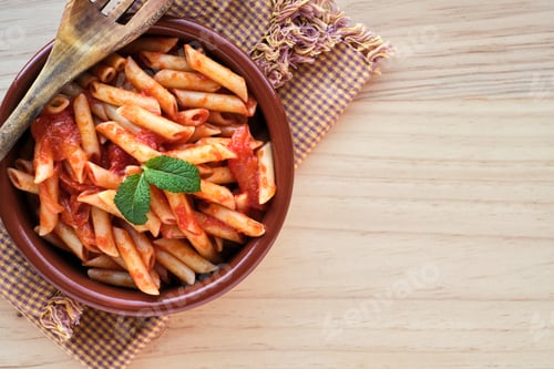 Preview: Macaroni and tomato in an earthenware casserole
