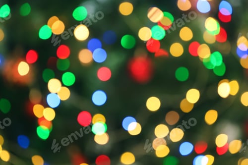 Preview: Blurred view of glowing Christmas lights as background. Festive mood