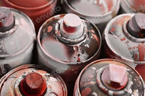 Preview: A lot of used spray cans of paint close-up. Dirty and smeared cans for drawing graffiti