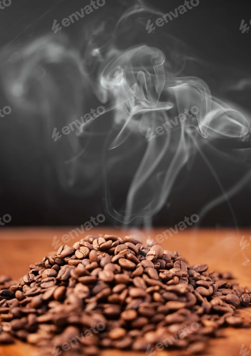 Preview: Coffee is calling and I must go. Still life shot of coffee beans on a wooden countertop.