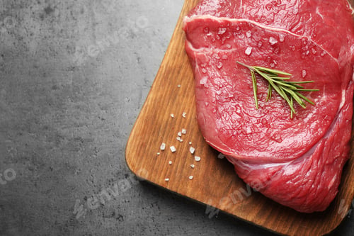 Preview: Fresh meat on grey table, top view. Space for text